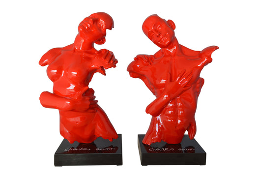 Modern resin statue of a woman hugged by a men -  Size: 13"L x 9"W x 24"H.