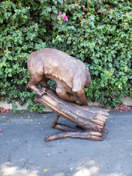 Bobcat Going Down a Tree Log Bronze Statue - Size: 43"L x 25"W x 41"H.