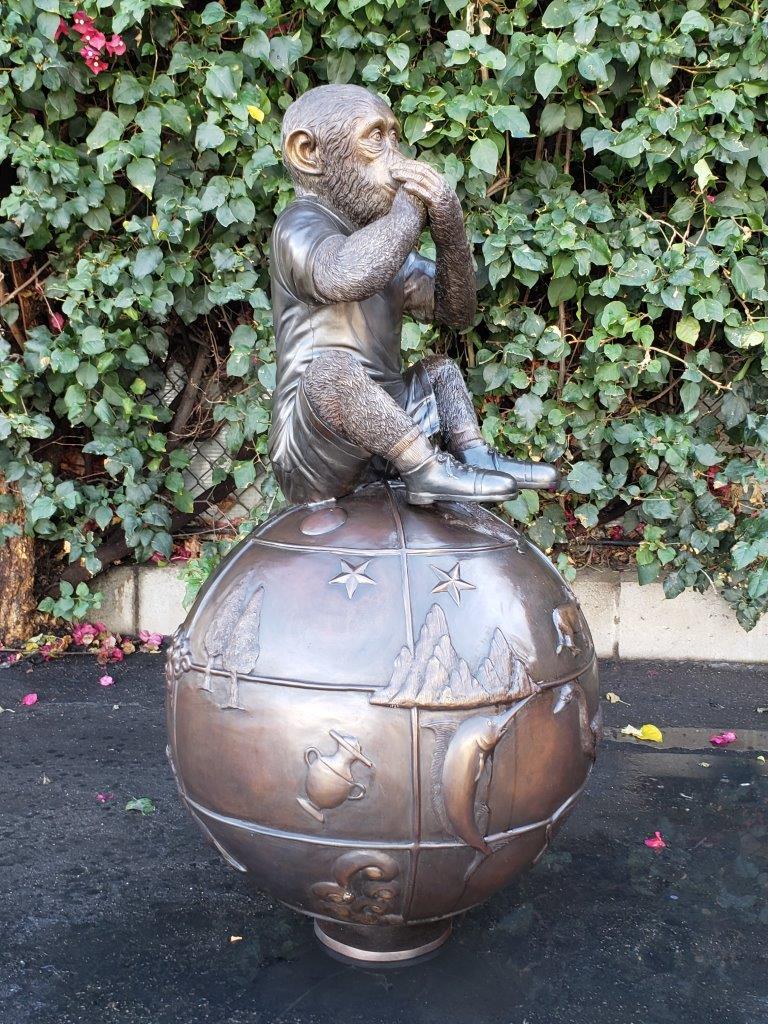 Bronze Statue of a Monkey on an Ornate Ball -  Size: 23"L x 23"W x 44"H.