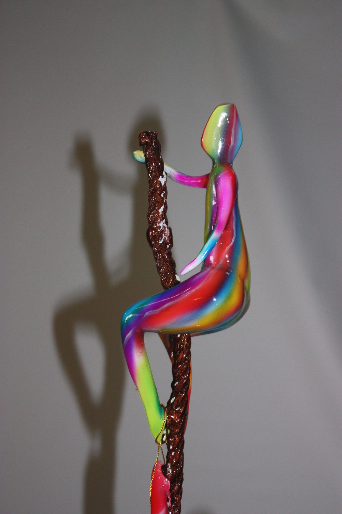 Three man made of Bronze climbing on rope - Size: 10"L x 13"W x 37"H.