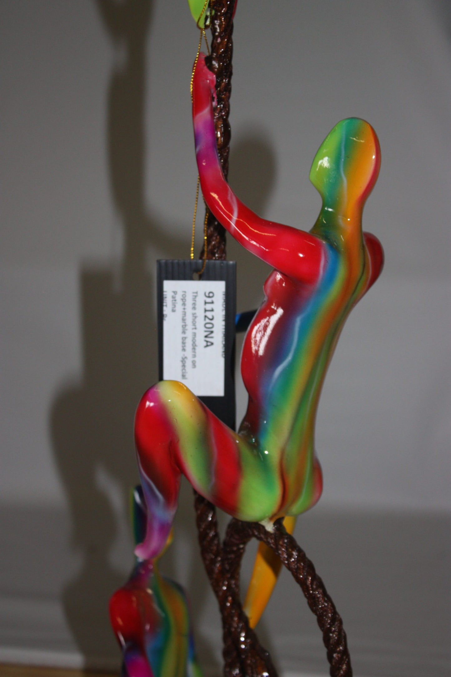 Three man made of Bronze climbing on rope - Size: 10"L x 13"W x 37"H.