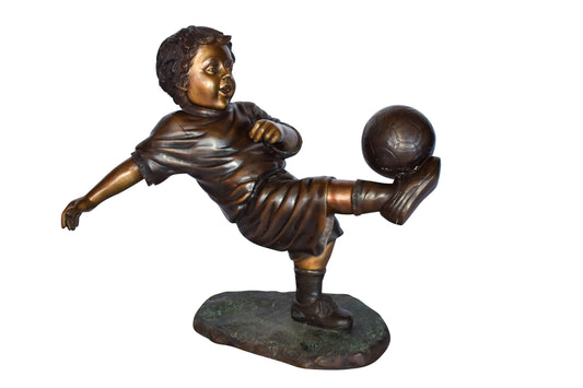 Young Boy Passionately Kicking Soccer Ball Bronze Statue  Size: 26" x 16" x 24"H