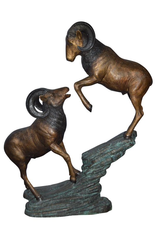 Two Life Size Rams on a rock Bronze Statue - Size: 49"L x 20"W x 64"H.