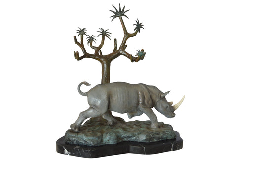 Rhino Relaxed under a tree bronze statue - Size: 22"L x 15"W x 25"H.