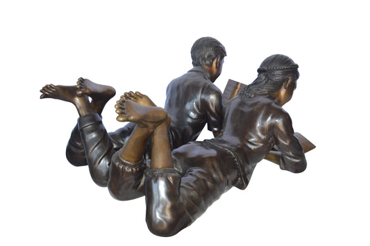 A Set of Boy and Girl Reading Books Bronze Statue -  Size: 31"L x 10"W x 14"H.