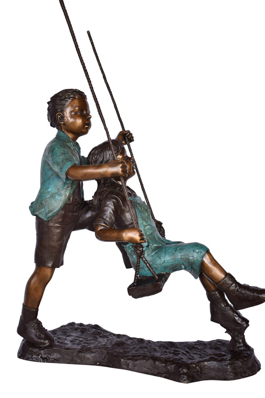 Boy and Girl Playing on a Swing bronze Statue - Size: 39"L x 17"W x 53"H.