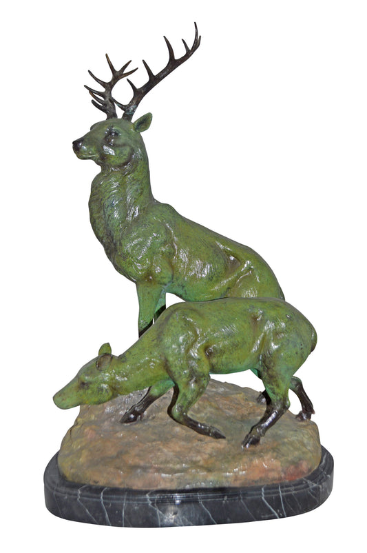 Two Deers Bronze Statue with a Green patina finish - Size: 15"L x 22"W x 32"H.