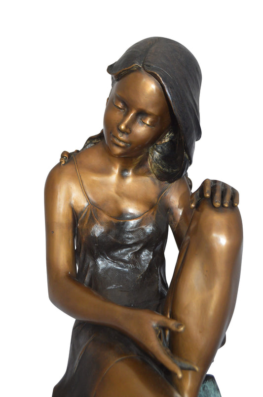 Beautiful Young Girl Sitting on a Tree Bronze Statue - 35"L x 50"W x 55"H.