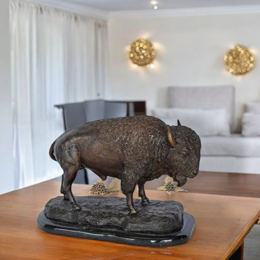 Bison standing and looking down Bronze Statue - Size: 11"L x 6"W x 8"H.