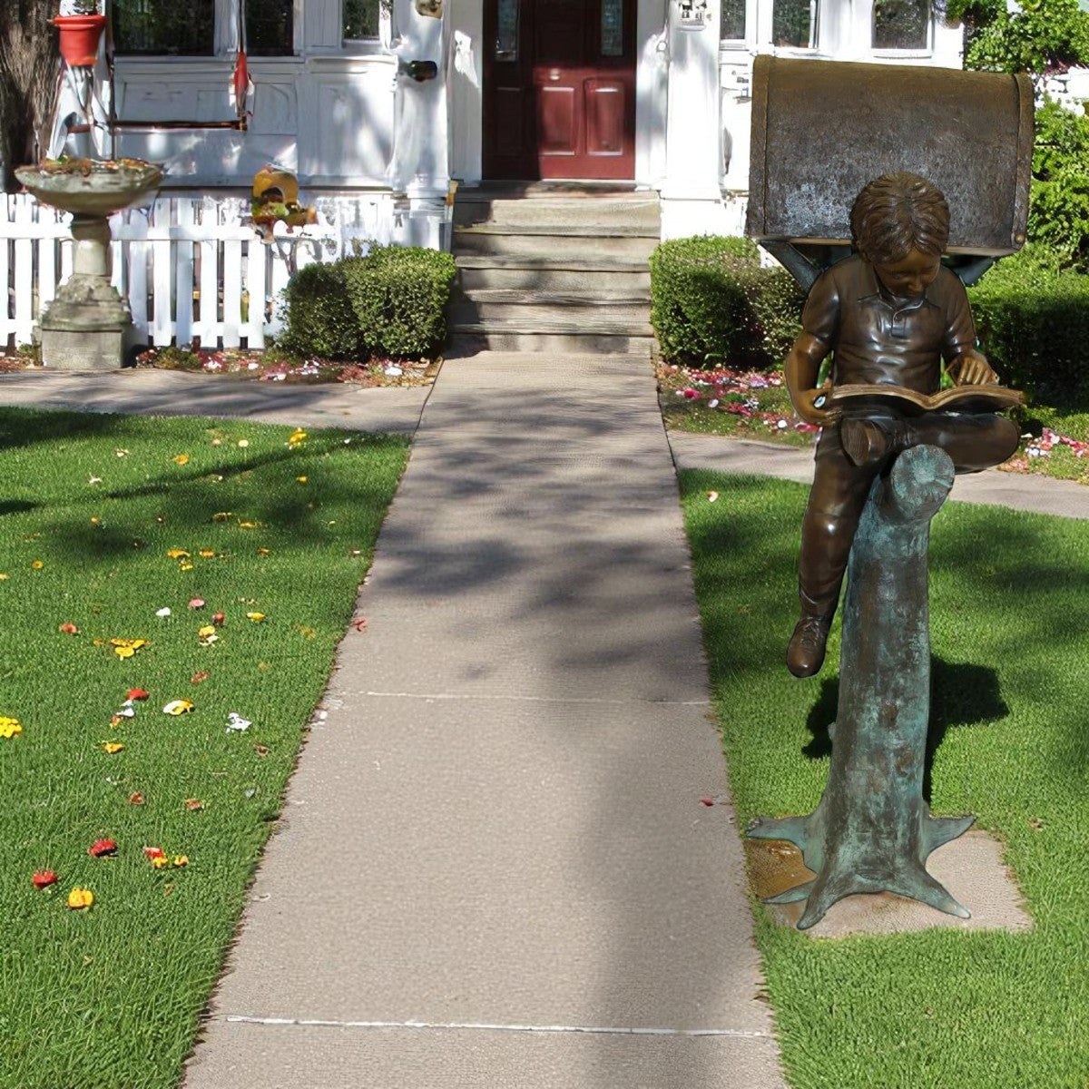 Boy Sitting by a Mailbox reading a book Bronze Statue - 16"L x 20"W x 50"H.