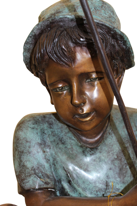 Boy Sitting on a Tree and Fishing Bronze Statue - Size: 36"L x 21"W x 37"H.
