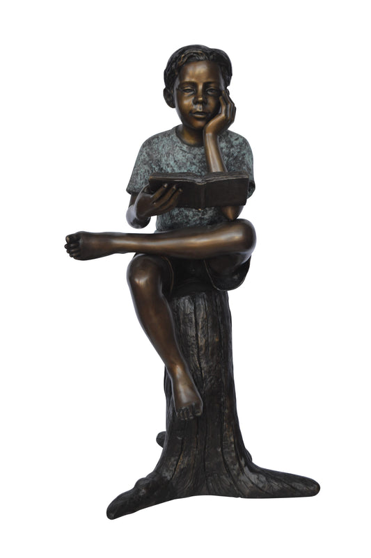 Boy Sitting on a Stump Reading a Book -  Size: 18"L x 20"W x 35"H.