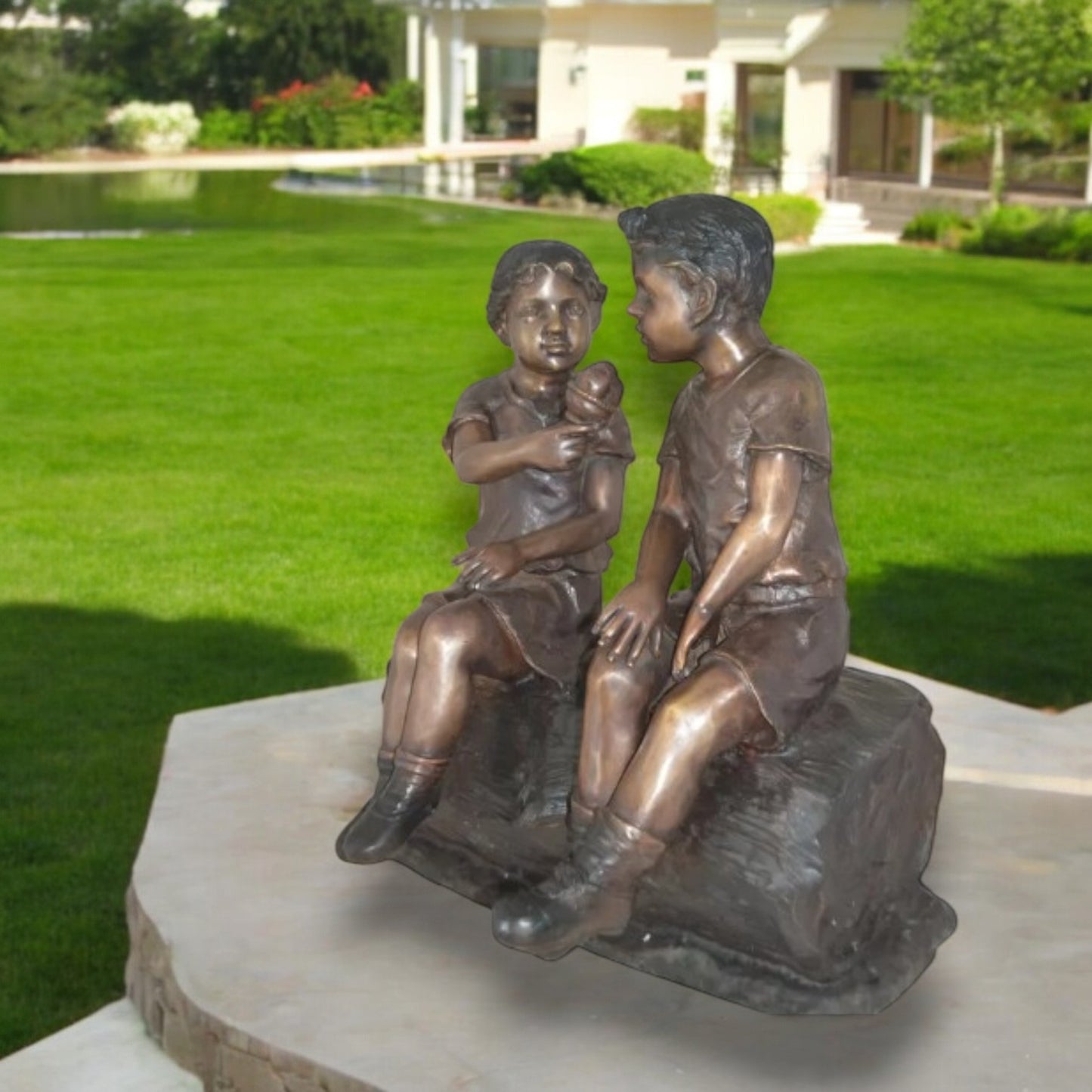 Boy and Girl enjoying an ice-cream bronze statue -  Size: 28"L x 24"W x 33"H.