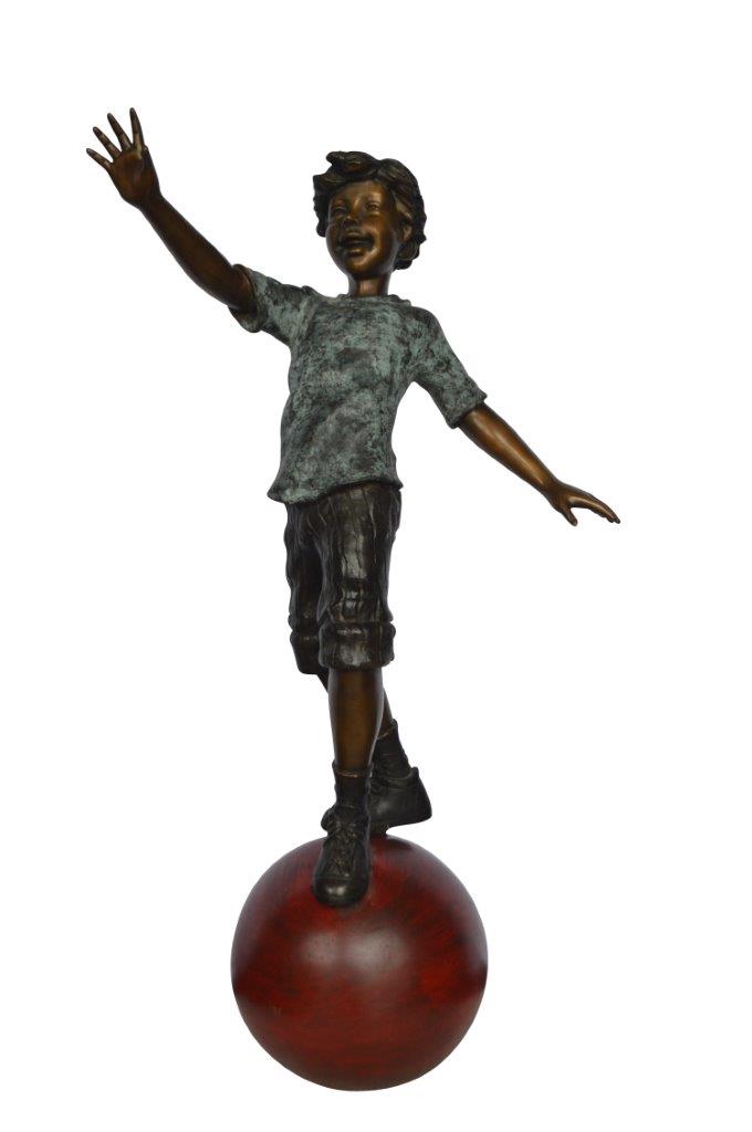 Boy on Ball Bronze Statue - Street Performer - Size: 23"L x 12"W x 39"H.