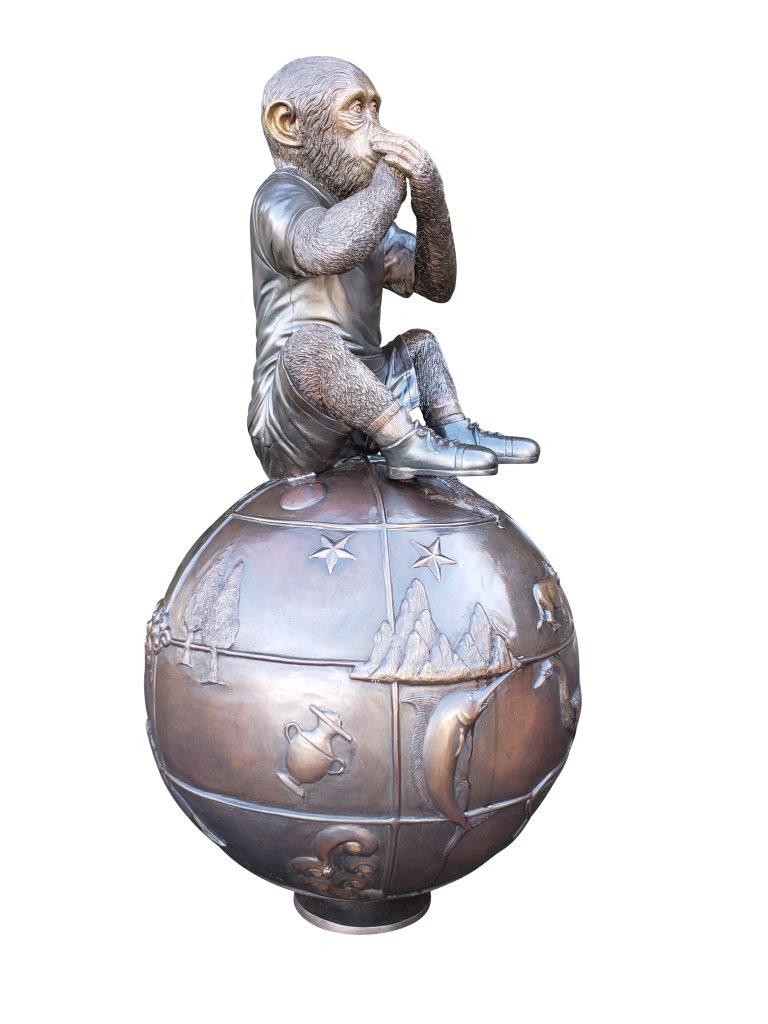 Bronze Statue of a Monkey on an Ornate Ball -  Size: 23"L x 23"W x 44"H.