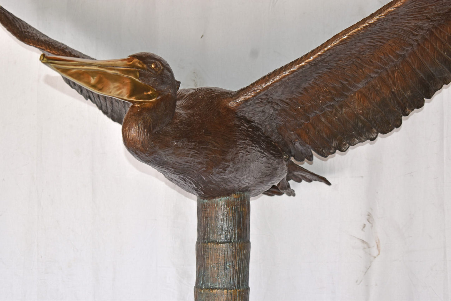 Life Size Pelican on a Three Bronze Statue - Size: 55"L x 46"W x 60"H.