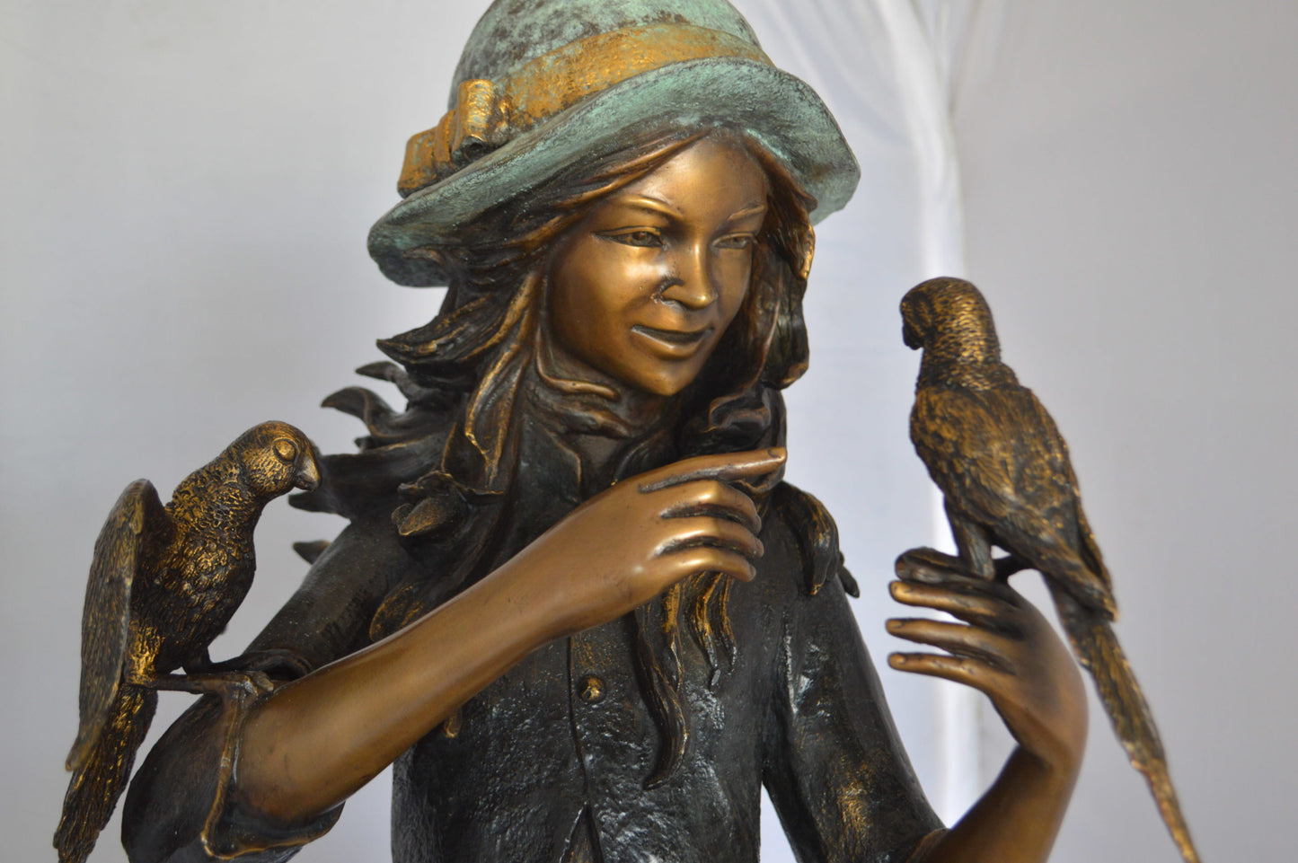Standing girl with parrots Bronze Statue - Size: 15"L x 16"W x 41"H.