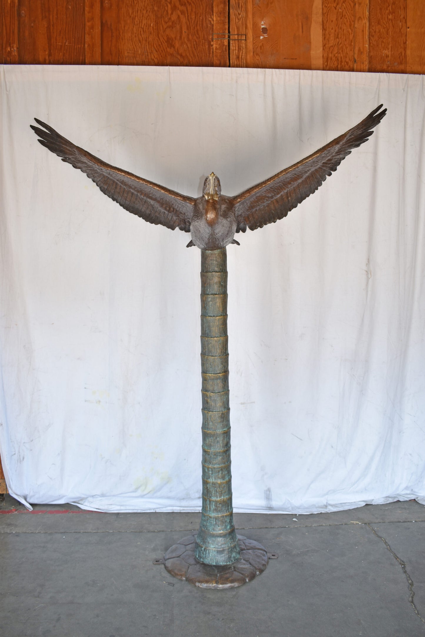 Life Size Pelican Flying Bronze Status - Size: 69"L x 45"W x 88"H.