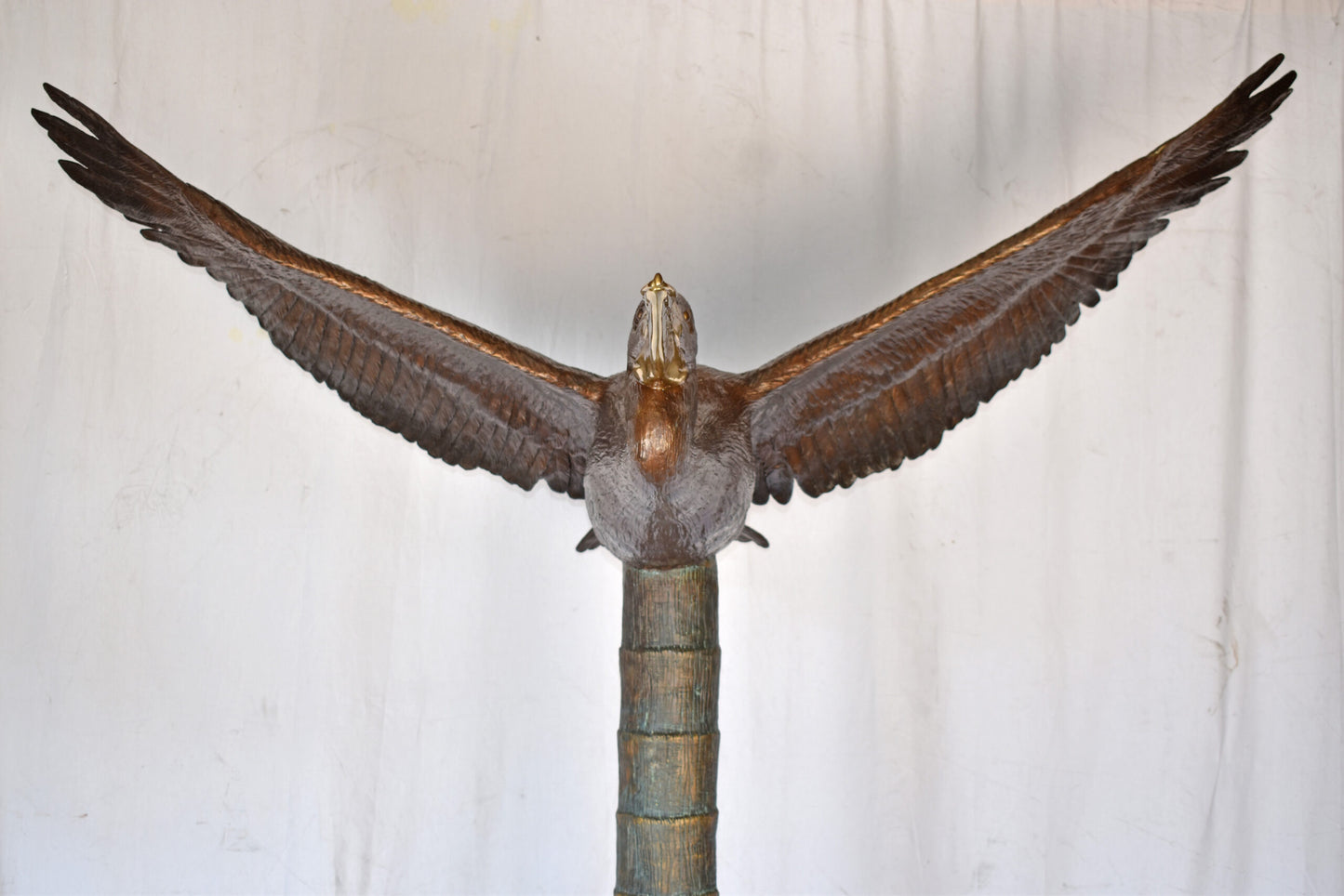 Life Size Pelican Flying Bronze Status - Size: 69"L x 45"W x 88"H.