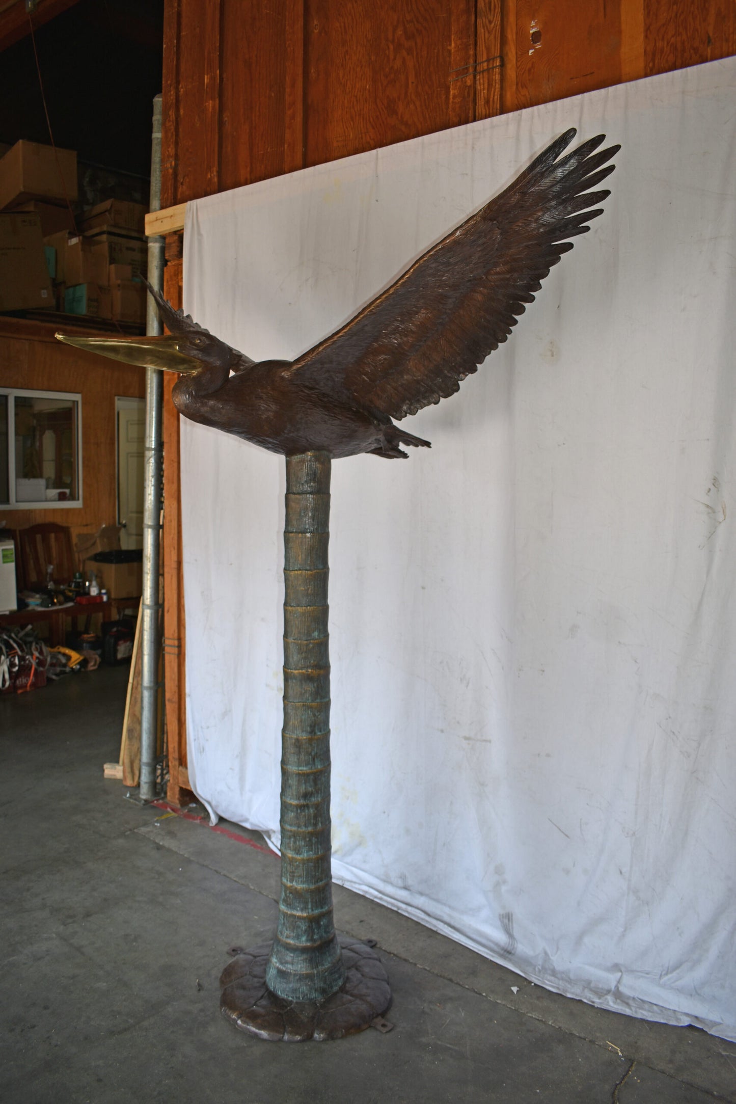 Life Size Pelican Flying Bronze Status - Size: 69"L x 45"W x 88"H.