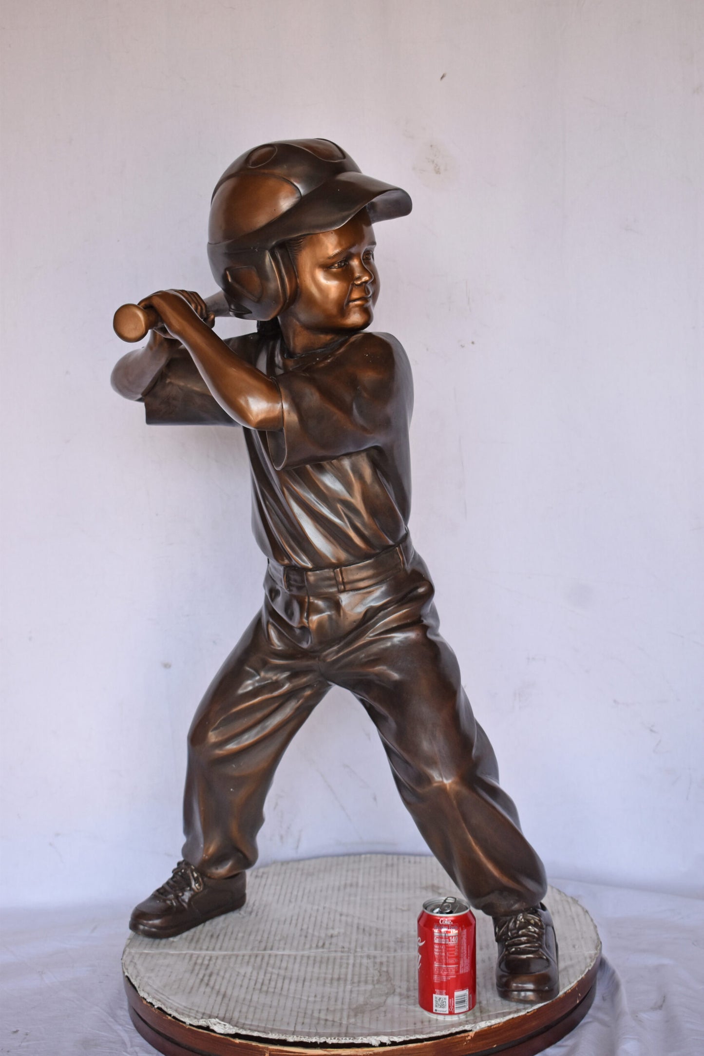 Girl batting a Baseball in Action Bronze Statue - Size: 20"L x 21"W x 40"H.