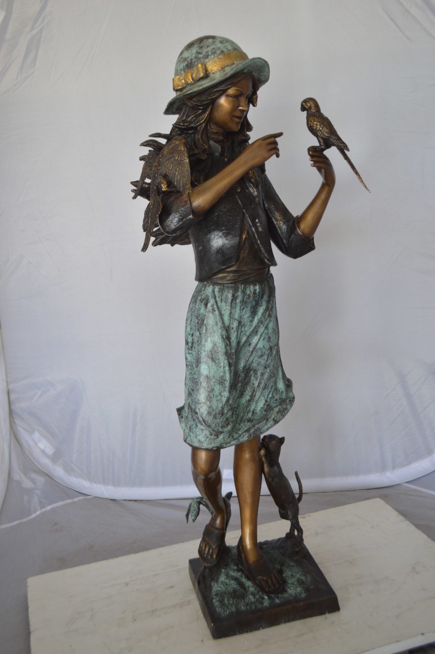 Standing girl with parrots Bronze Statue - Size: 15"L x 16"W x 41"H.