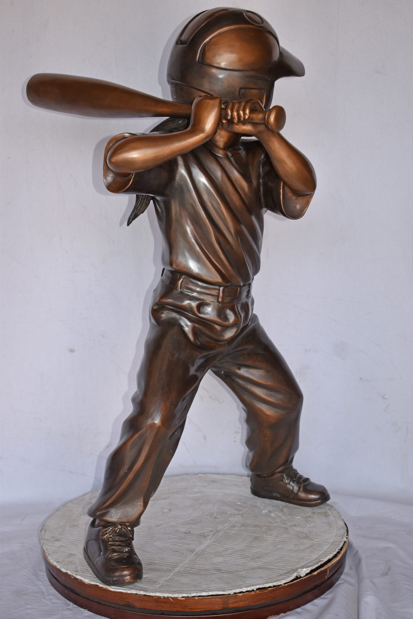 Girl batting a Baseball in Action Bronze Statue - Size: 20"L x 21"W x 40"H.