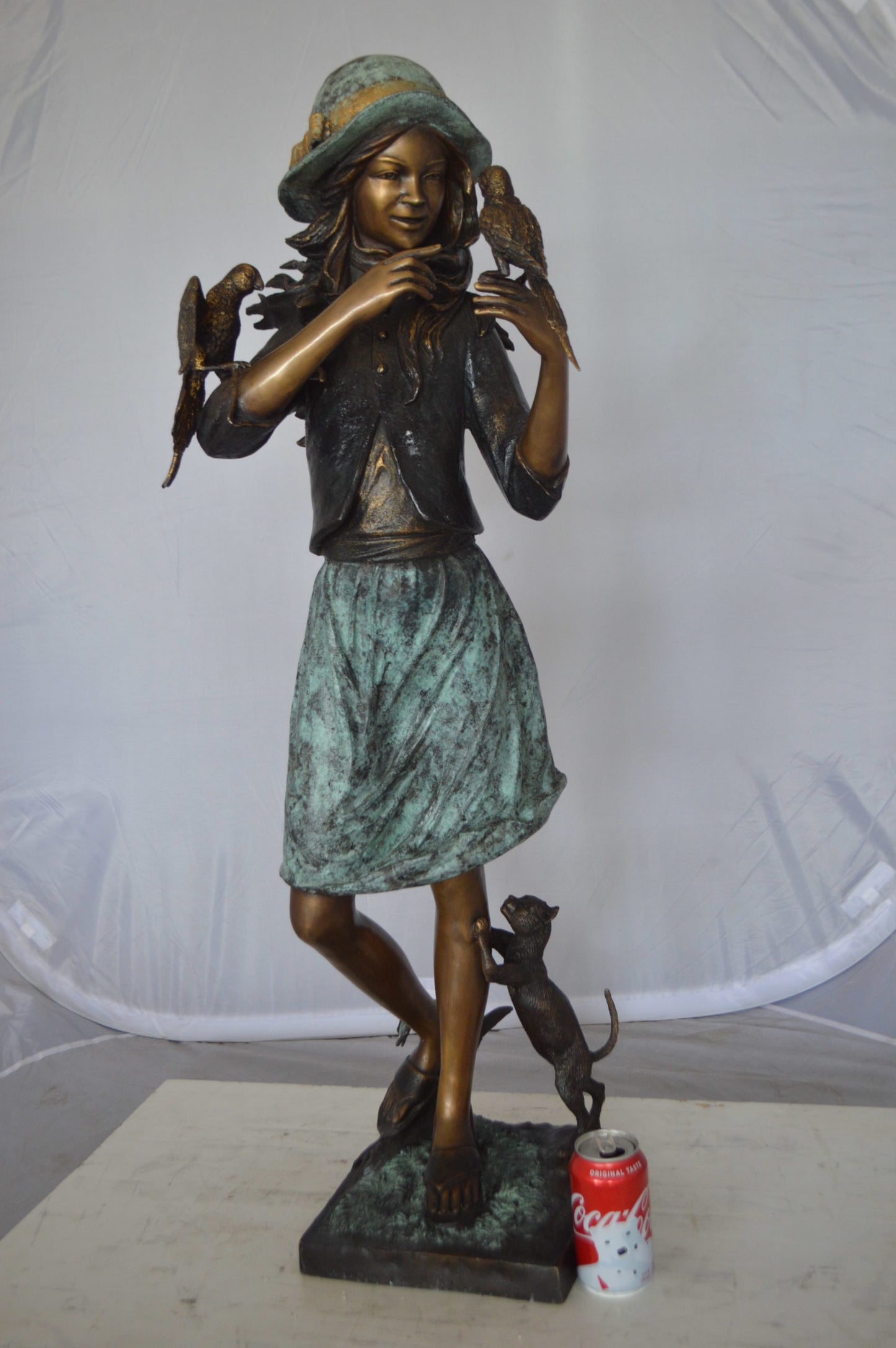 Standing girl with parrots Bronze Statue - Size: 15"L x 16"W x 41"H.
