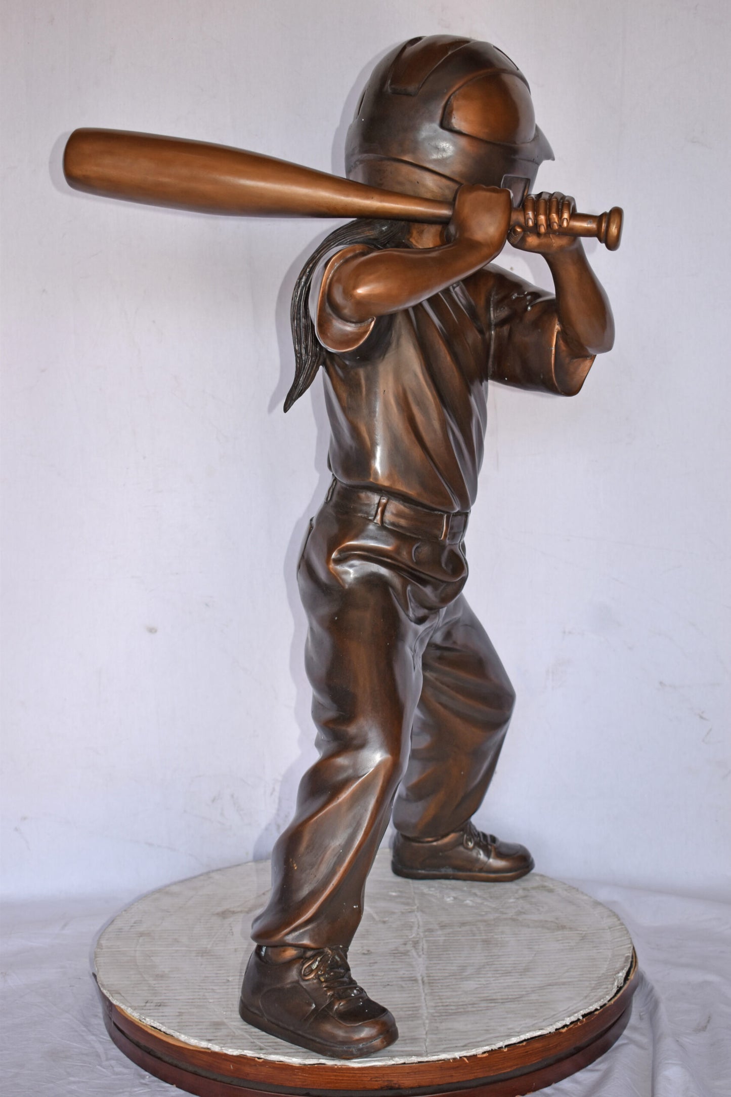 Girl batting a Baseball in Action Bronze Statue - Size: 20"L x 21"W x 40"H.