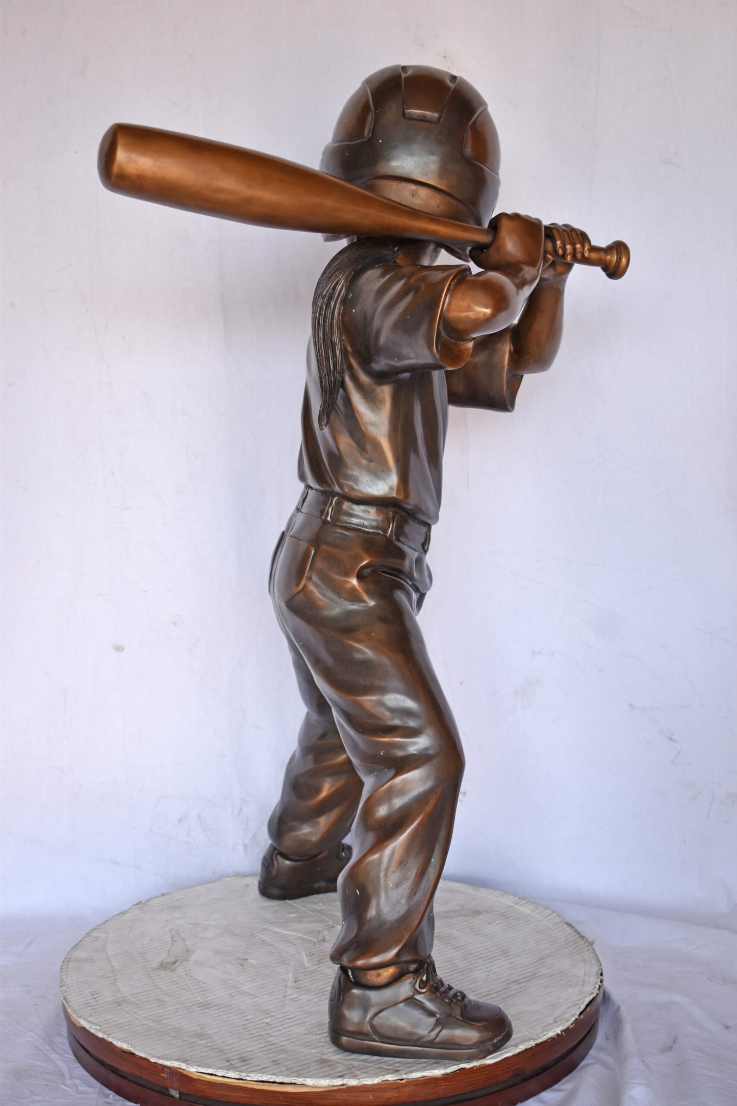 Girl batting a Baseball in Action Bronze Statue - Size: 20"L x 21"W x 40"H.