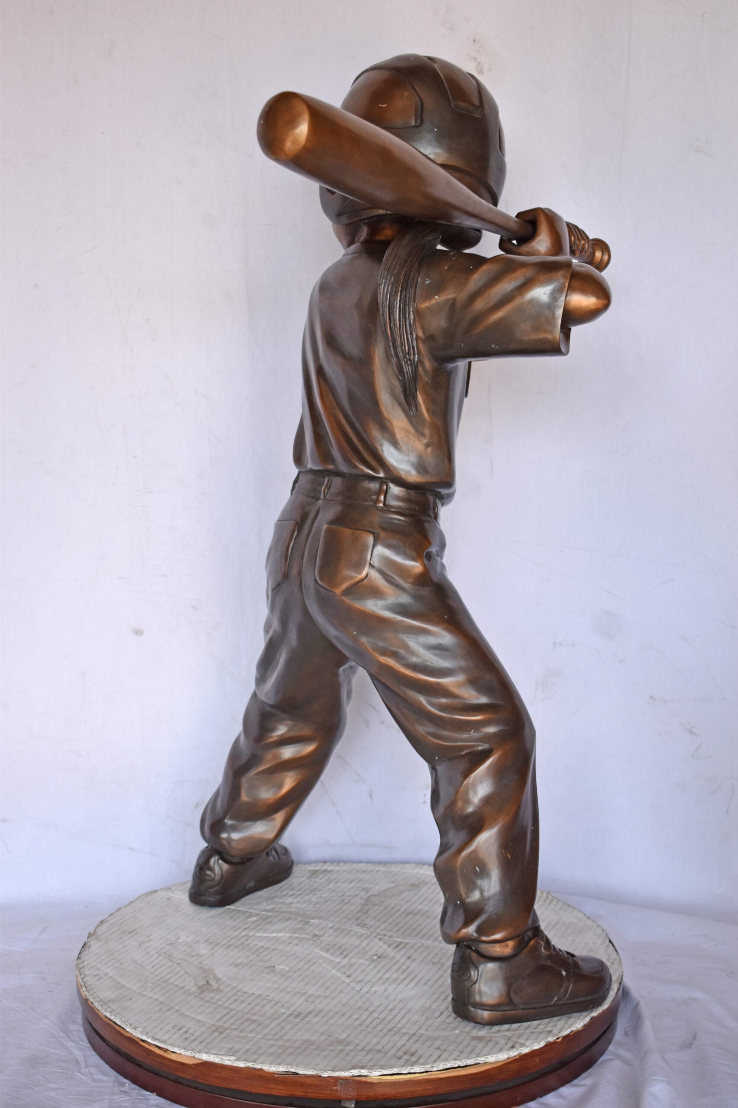 Girl batting a Baseball in Action Bronze Statue - Size: 20"L x 21"W x 40"H.