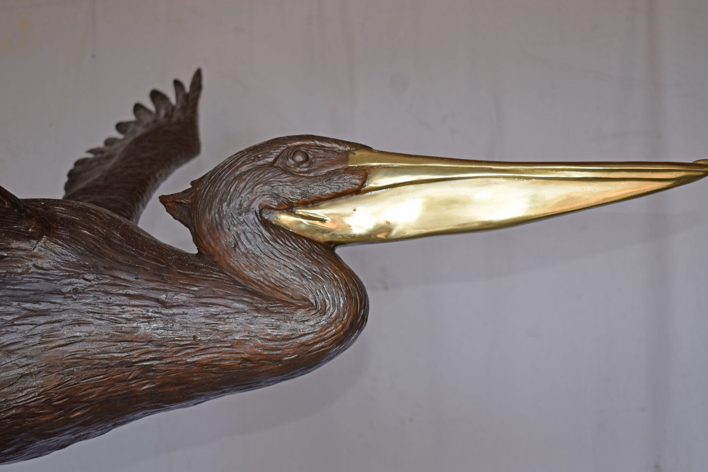 Life Size Pelican Flying Bronze Status - Size: 69"L x 45"W x 88"H.