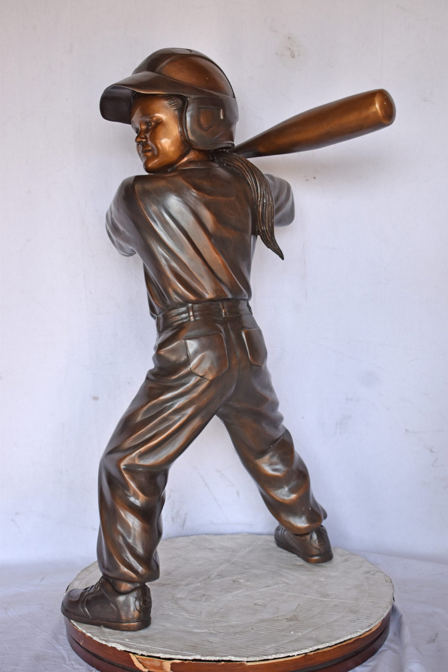 Girl batting a Baseball in Action Bronze Statue - Size: 20"L x 21"W x 40"H.