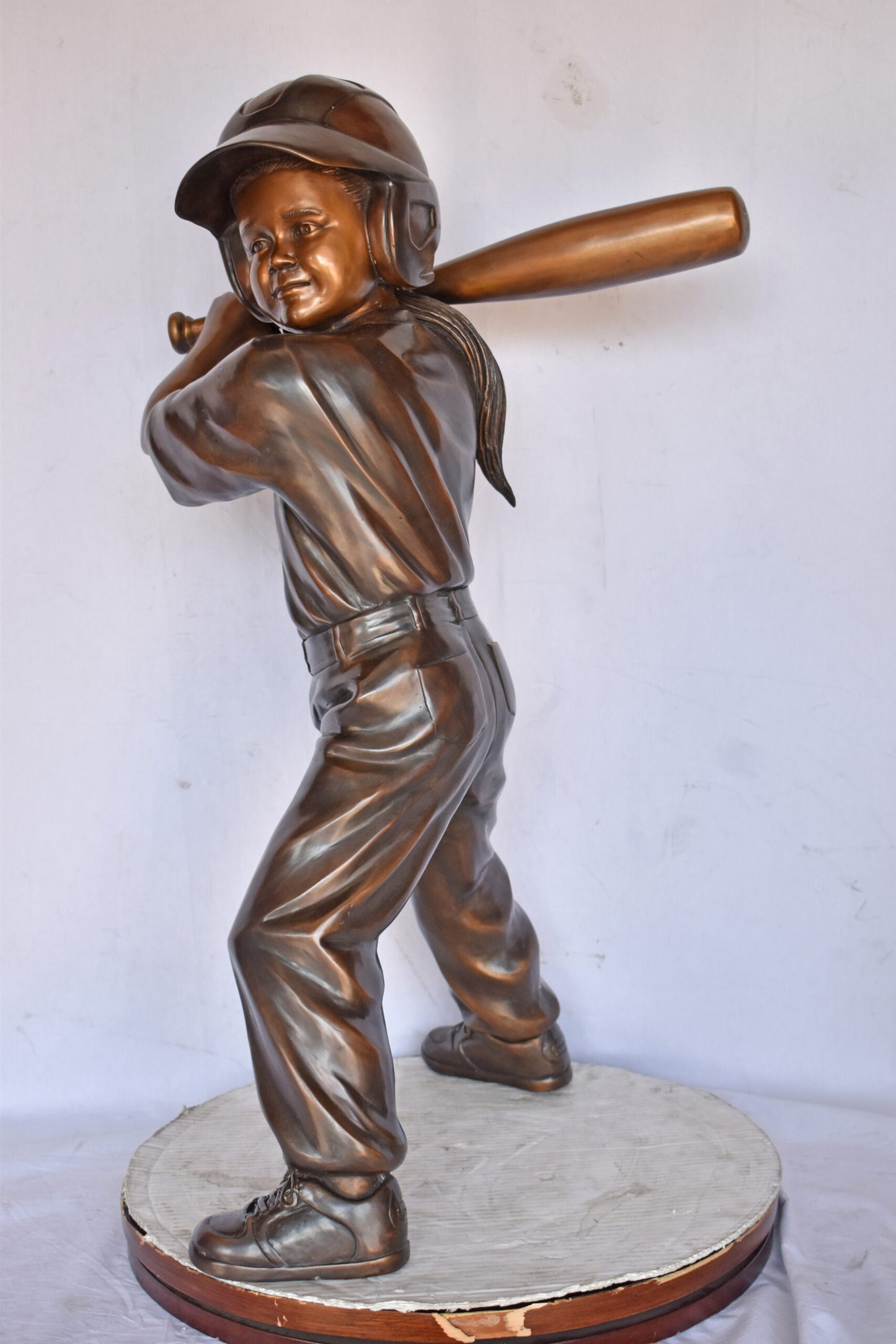 Girl batting a Baseball in Action Bronze Statue - Size: 20"L x 21"W x 40"H.