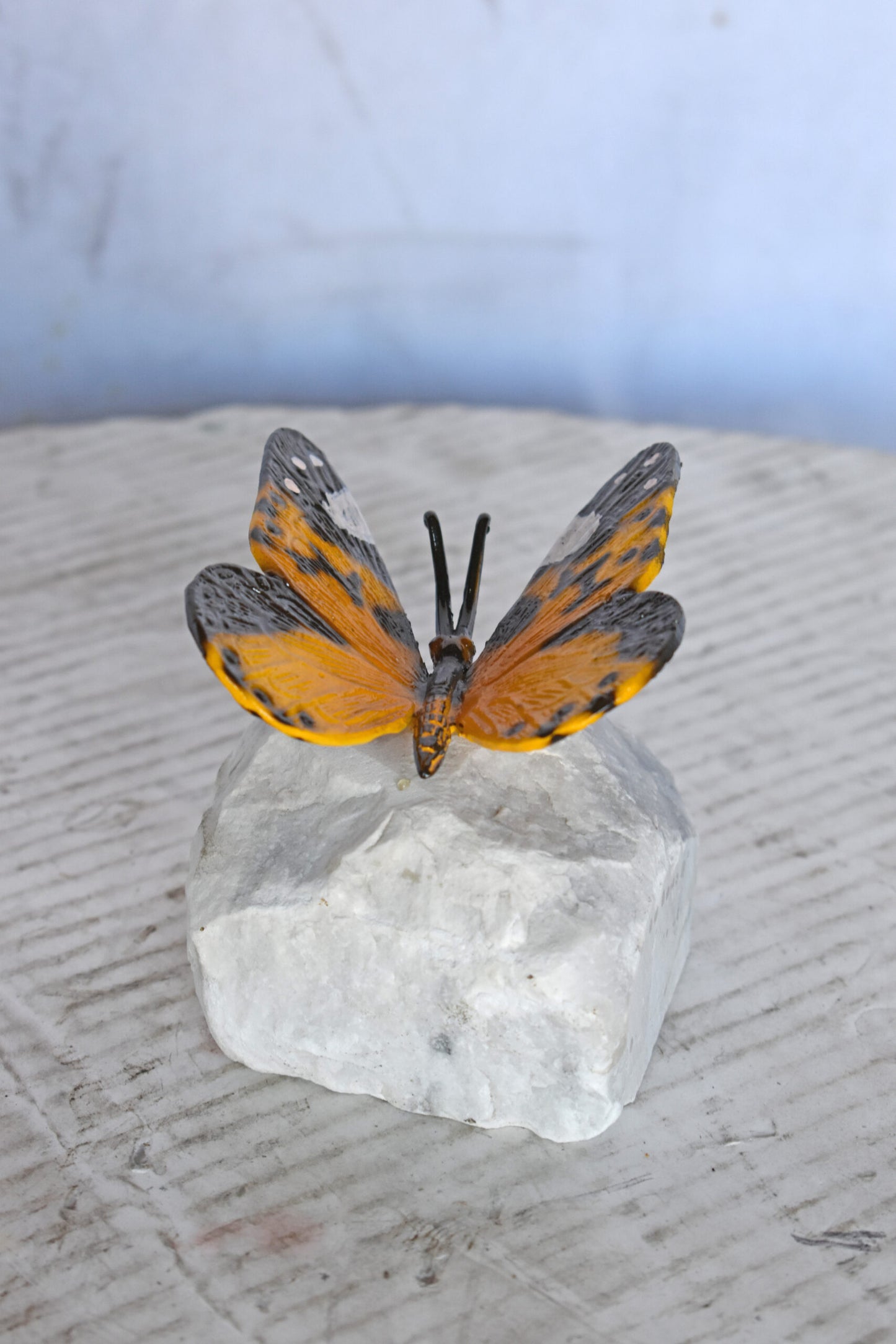 Orange Butterfly made of Bronze mounted on a rock - Size: 5"L x 5"W x 4"H.