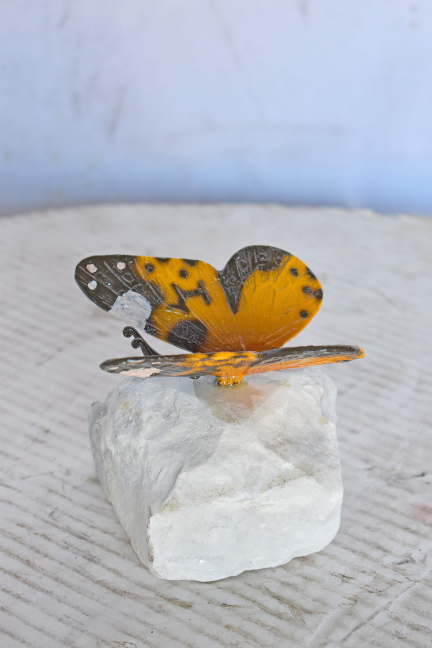 Orange Butterfly made of Bronze mounted on a rock - Size: 5"L x 5"W x 4"H.