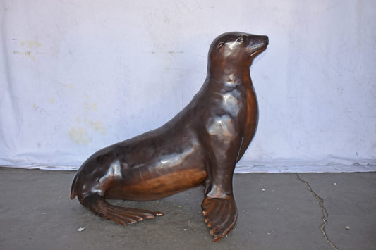 Perched Life Size Seal bronze statue - Size: 40"L x 35"W x 31"H.