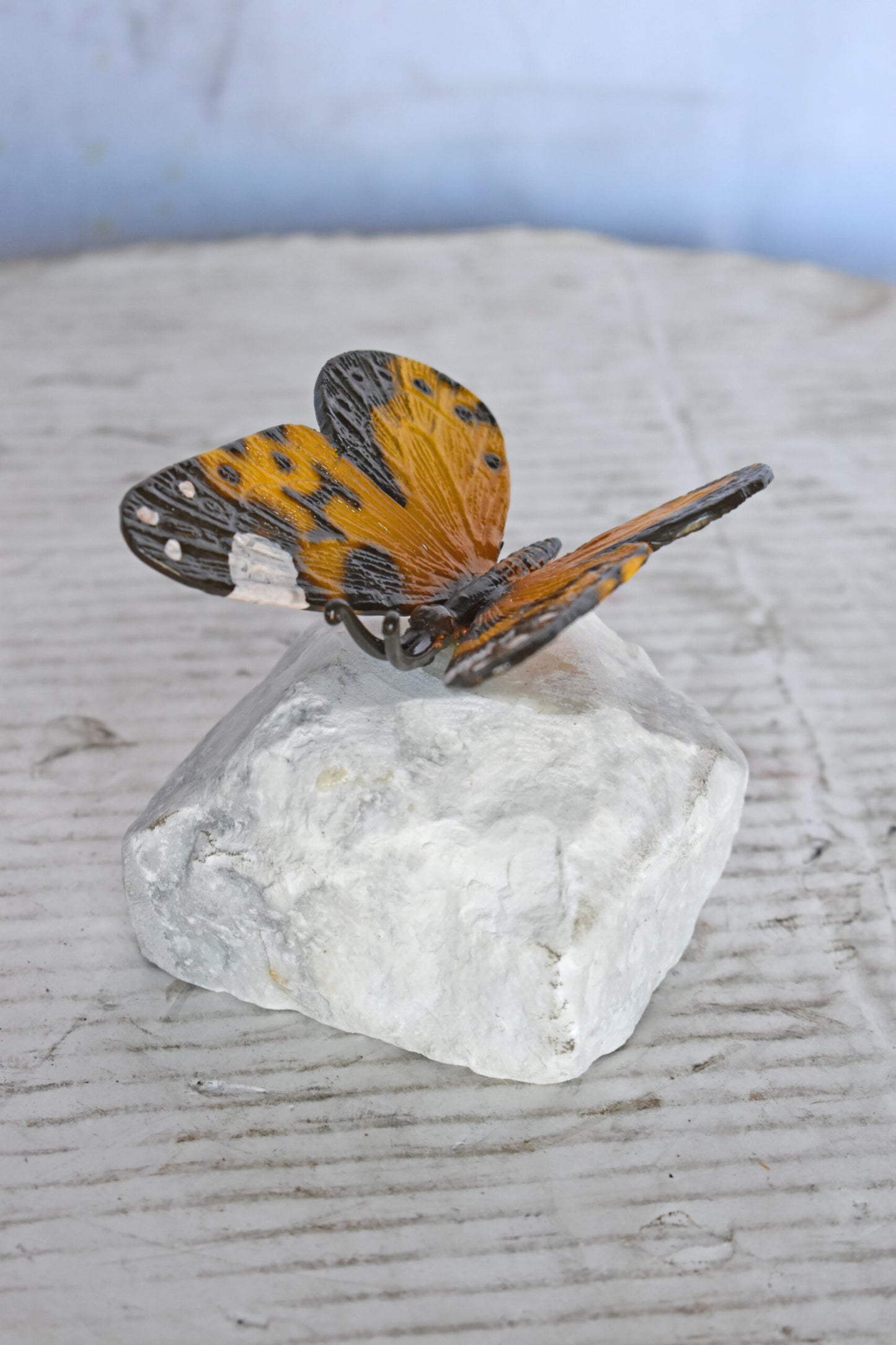 Orange Butterfly made of Bronze mounted on a rock - Size: 5"L x 5"W x 4"H.
