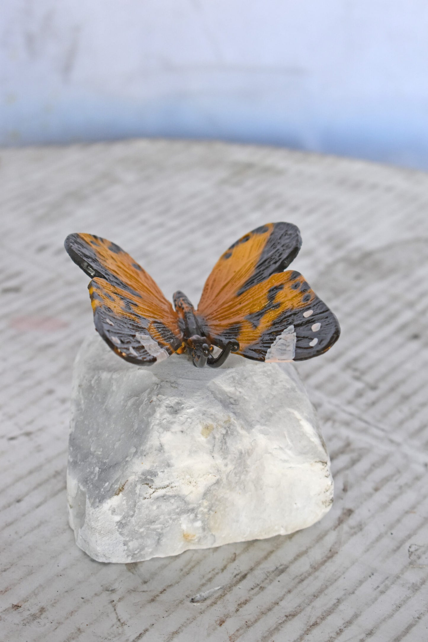 Orange Butterfly made of Bronze mounted on a rock - Size: 5"L x 5"W x 4"H.
