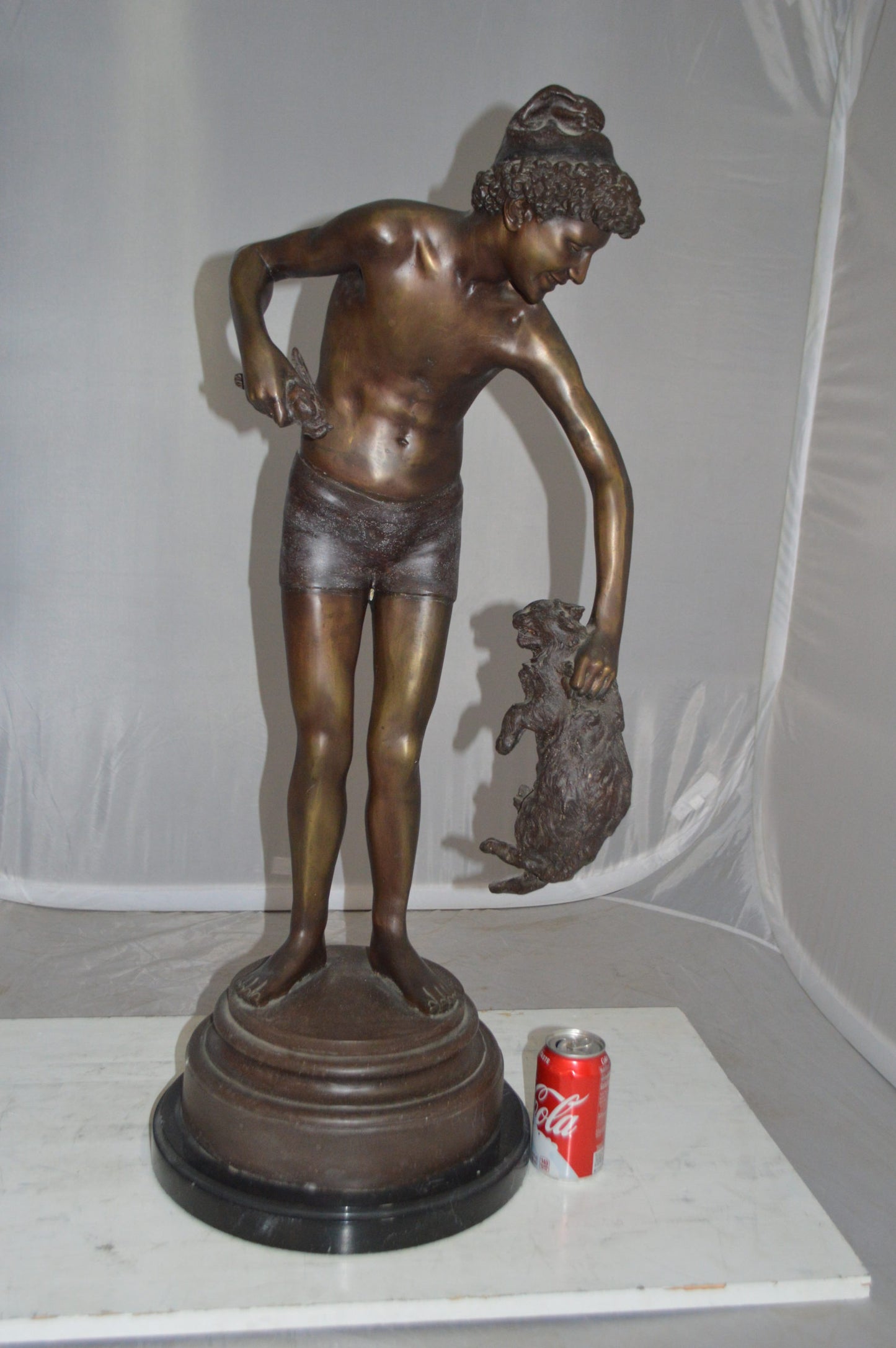 Boy holding a Dog and a Bird Bronze Statue - Size: 15"L x 15"W x 36"H.
