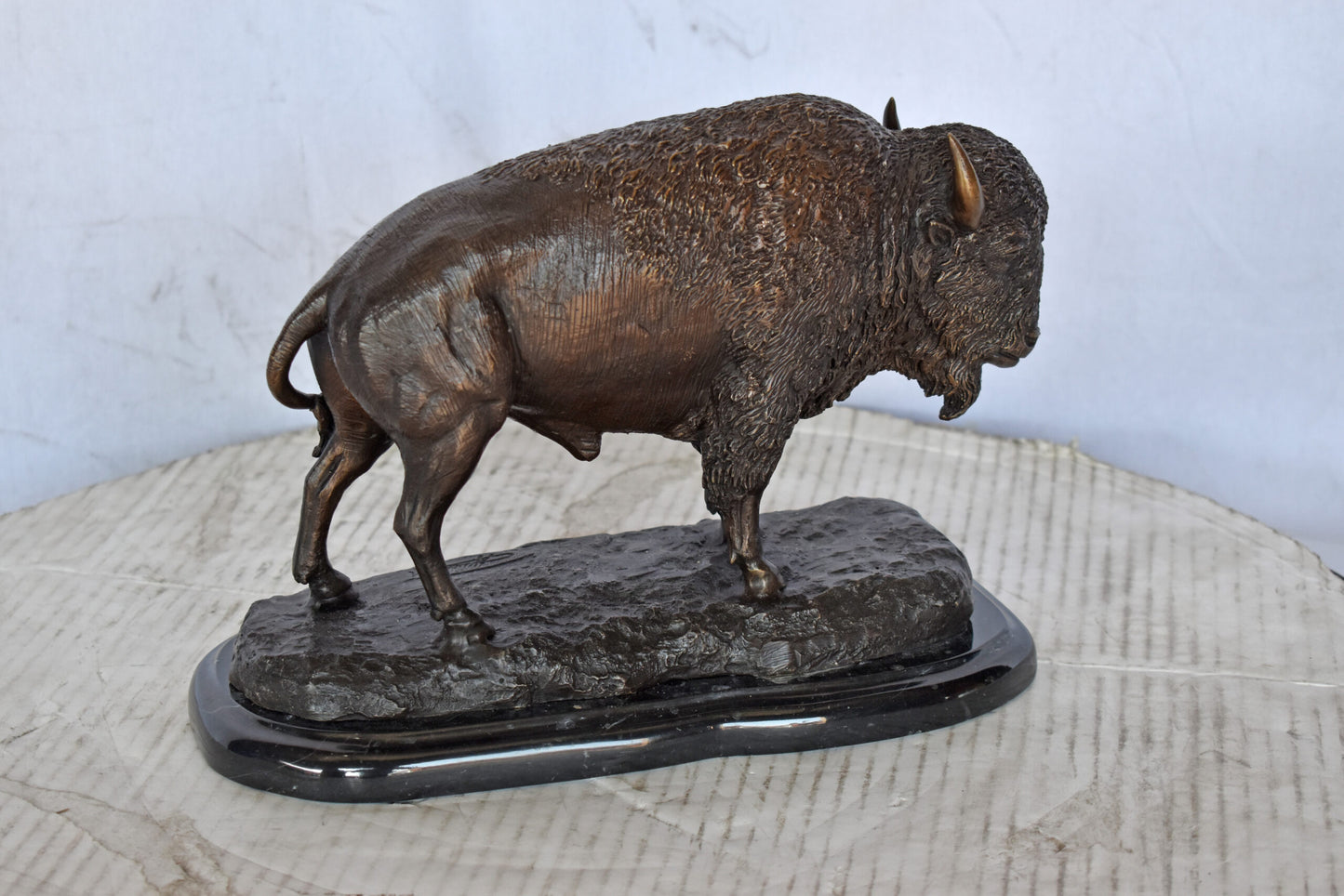 Bison standing and looking down Bronze Statue - Size: 11"L x 6"W x 8"H.