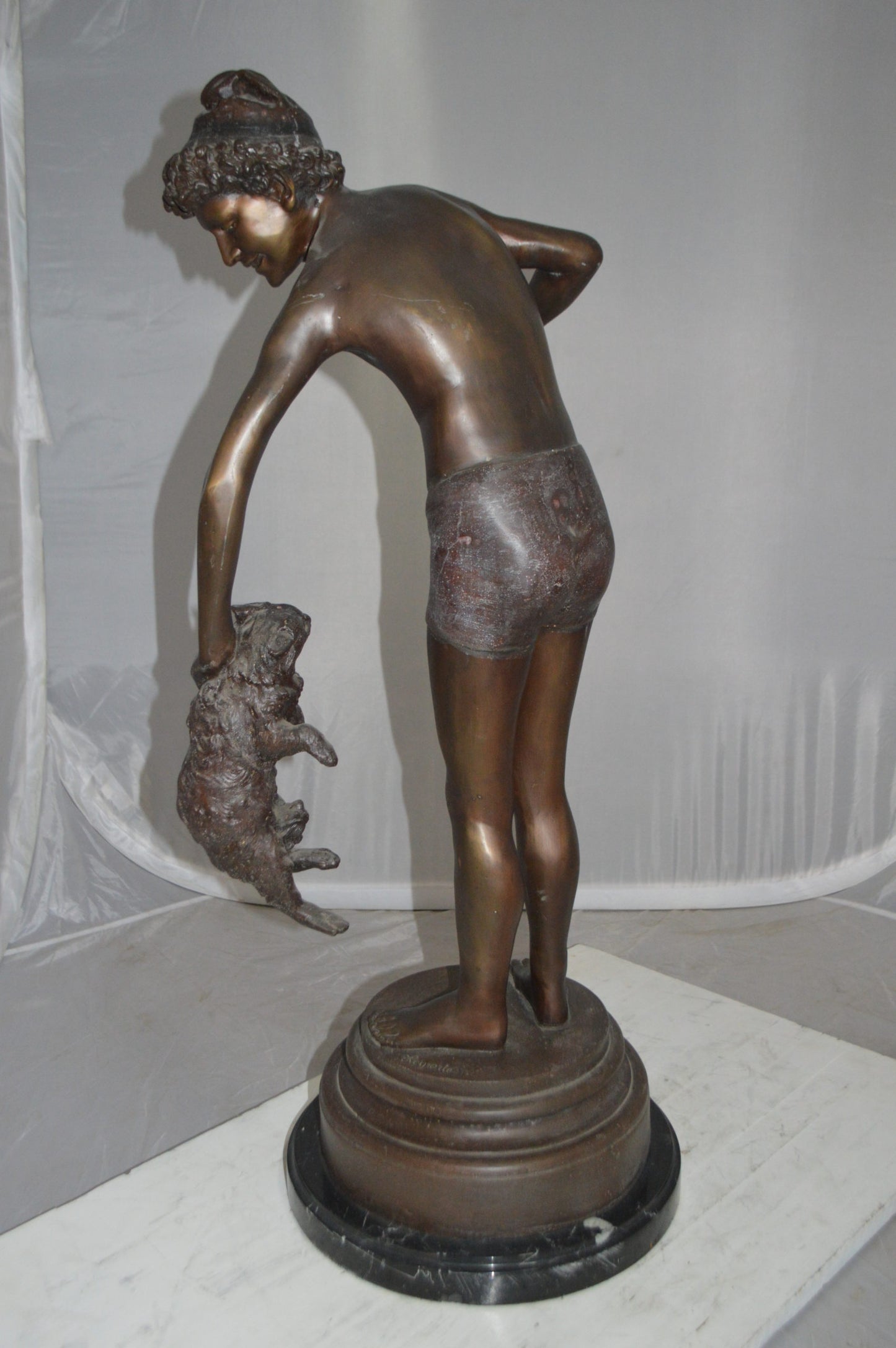 Boy holding a Dog and a Bird Bronze Statue - Size: 15"L x 15"W x 36"H.
