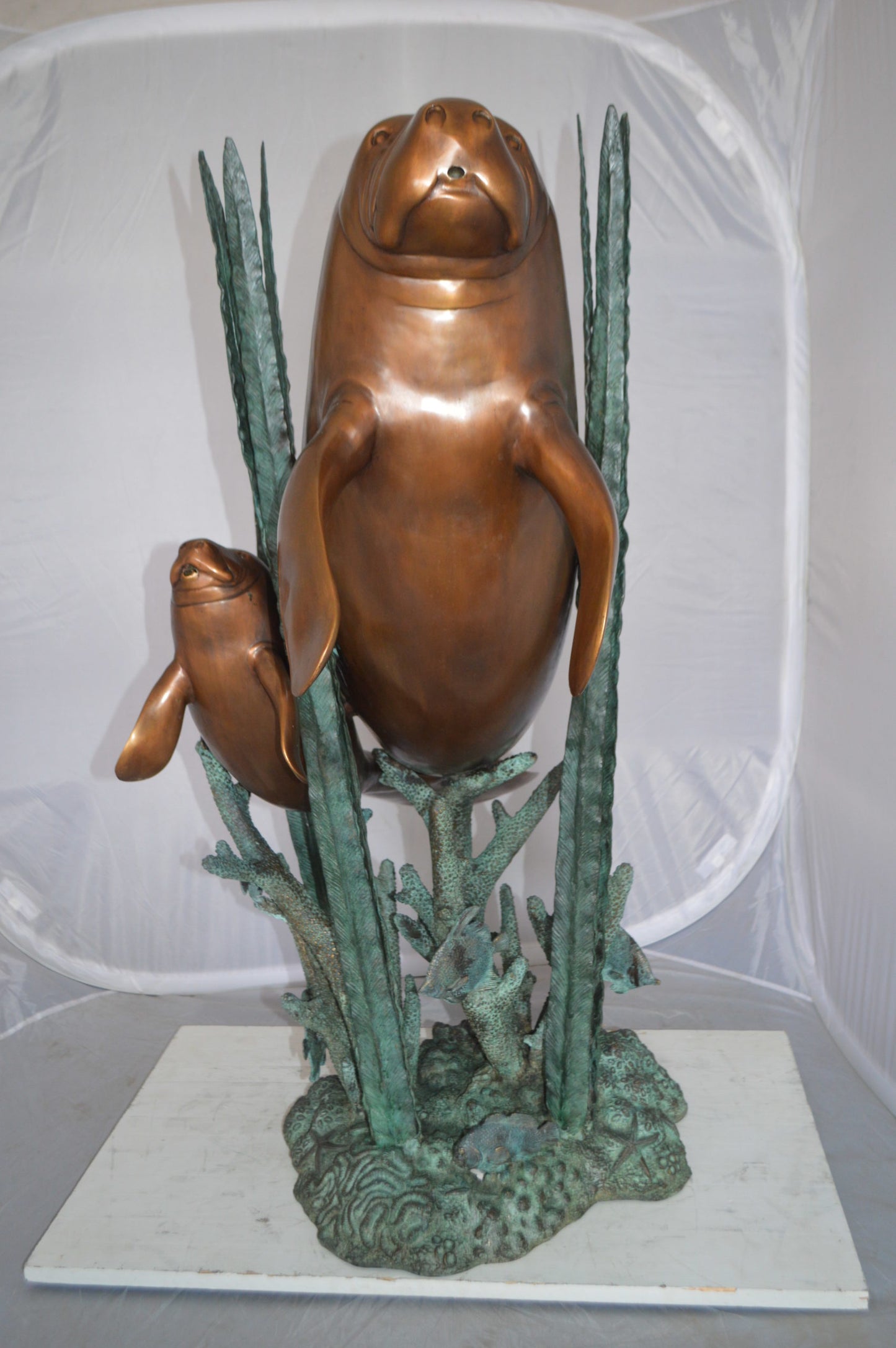 Two Large Manatees swimming Bronze Fountain Statue - Size: 23"L x 42"W x 42"H.