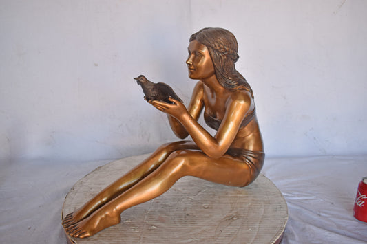 Young Beautiful Girl Helping A Bird Fly - Size: 22"L x 7"W x 18"H.