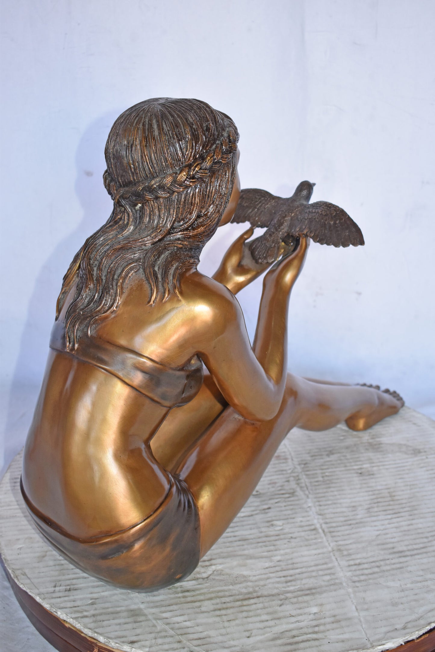 Young Beautiful Girl Helping A Bird Fly - Size: 22"L x 7"W x 18"H.
