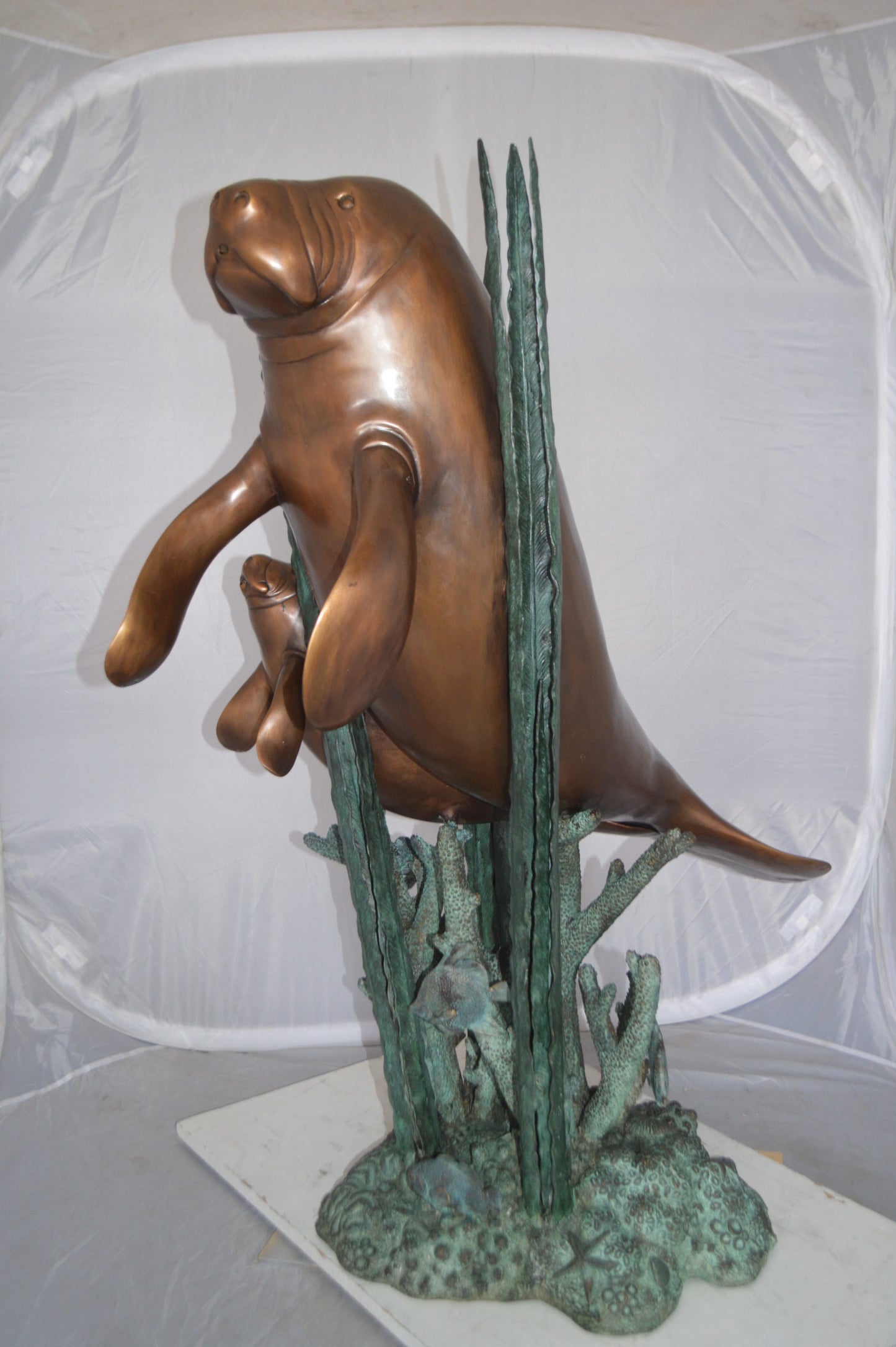 Two Large Manatees swimming Bronze Fountain Statue - Size: 23"L x 42"W x 42"H.