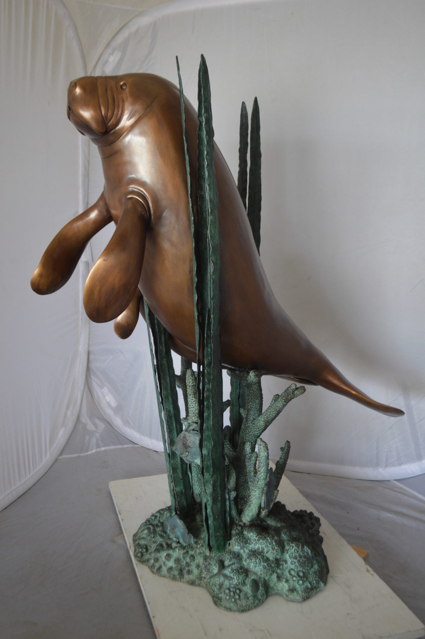 Two Large Manatees swimming Bronze Fountain Statue - Size: 23"L x 42"W x 42"H.