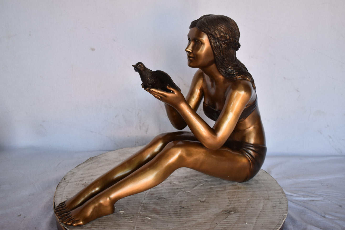 Young Beautiful Girl Helping A Bird Fly - Size: 22"L x 7"W x 18"H.