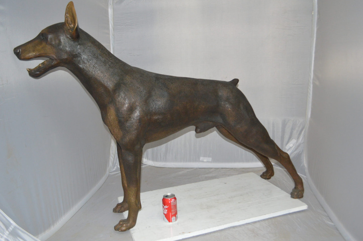 Doberman - Large Bronze Statue -  Size: 14"L x 52"W x 38"H.