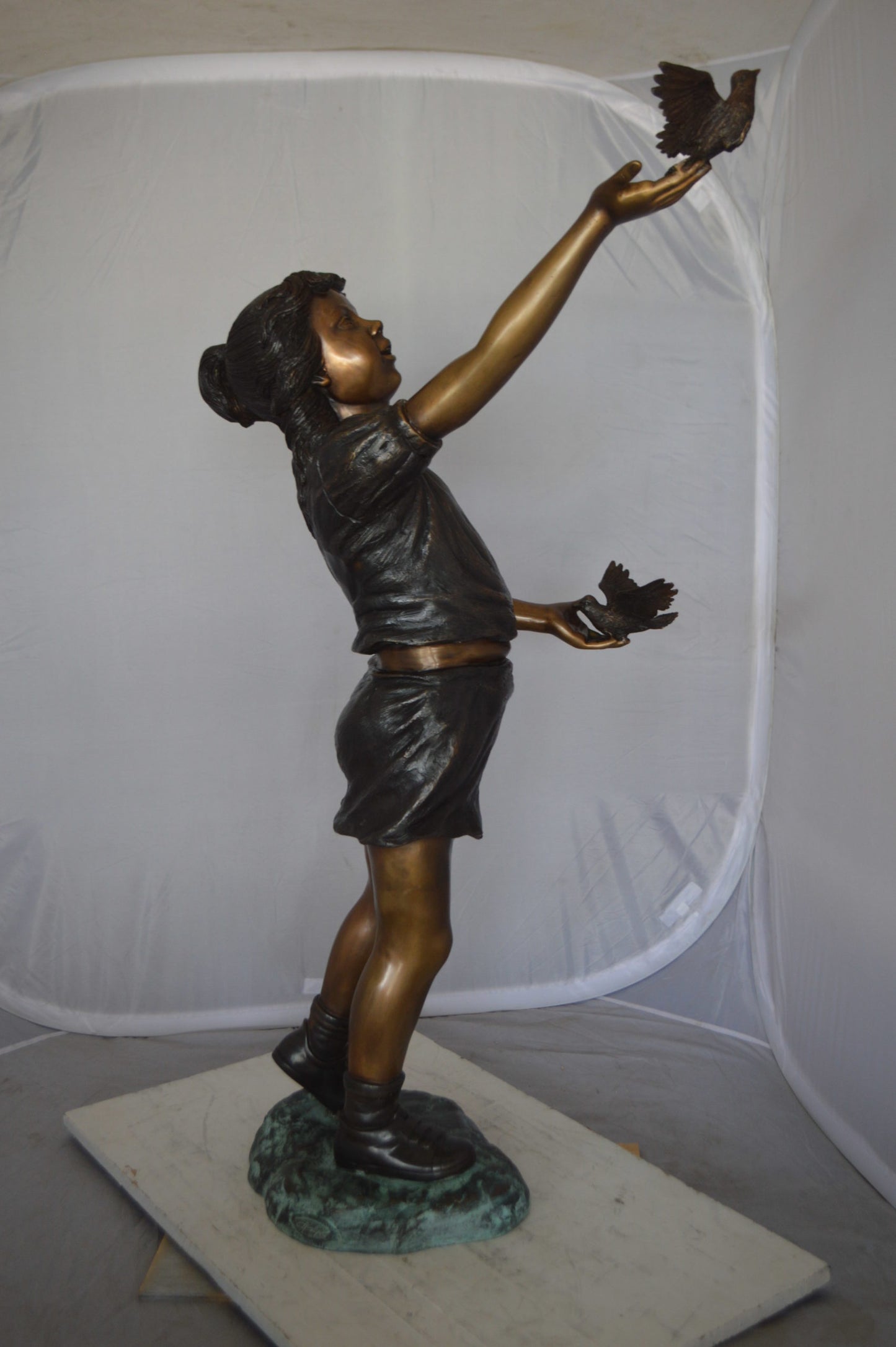 Girl - sandy, with two birds Bronze Statue - Size: 25"L x 20"W x 42"H.